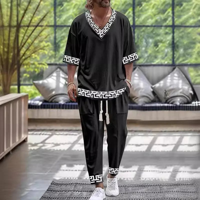 Women's cropped sleeve V-neck trousers suit in thin polyester fabric showing jacket and matching trousers