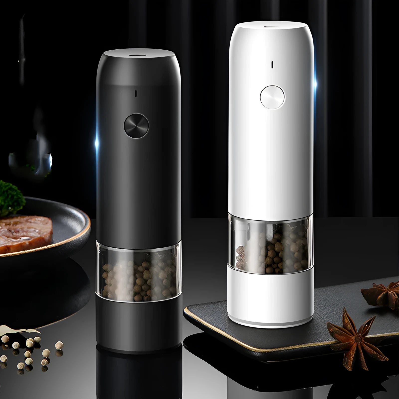 Black and silver rechargeable electric pepper grinder with clear acrylic body on a kitchen counter