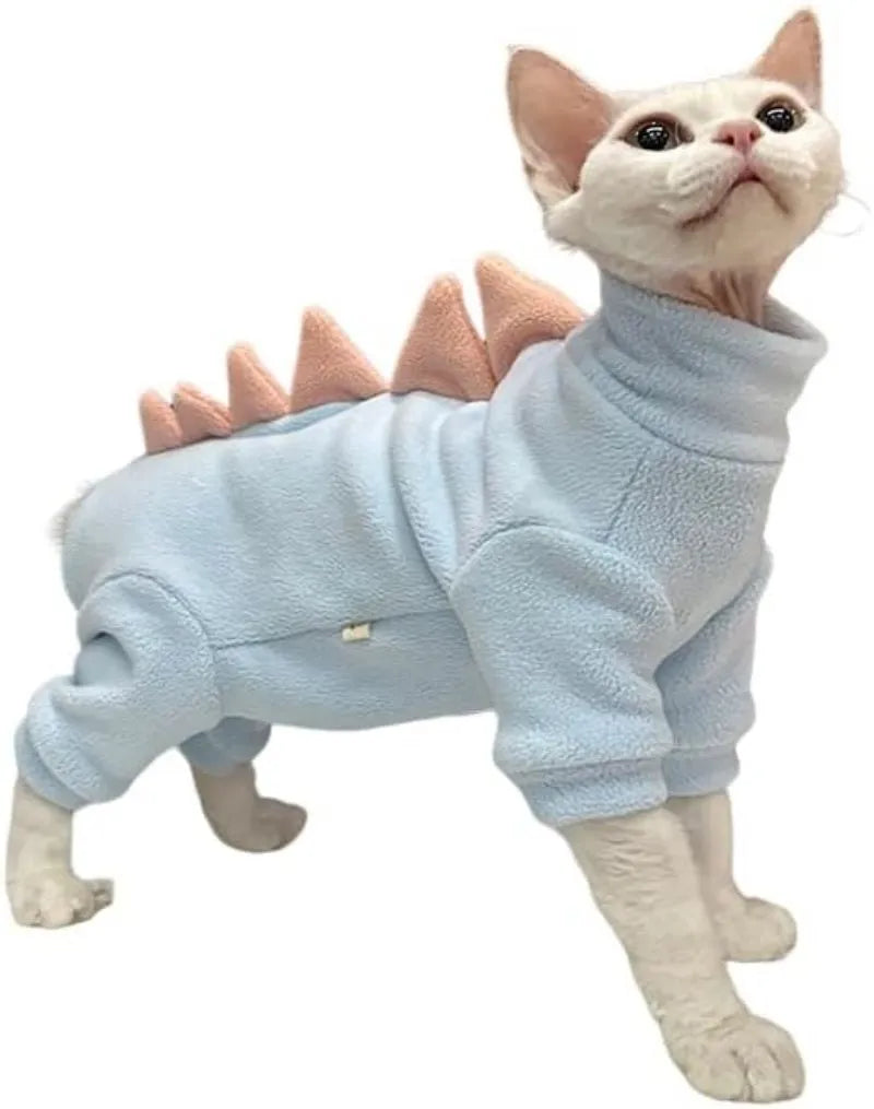 Sphynx cat wearing dinosaur costume with fleece material and tail spikes