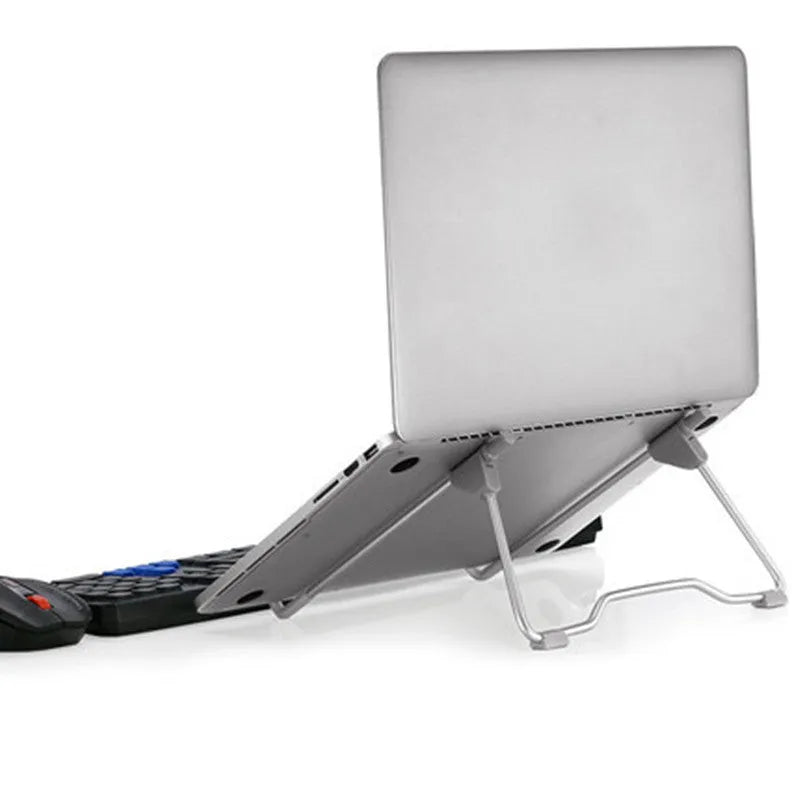 Grey foldable aluminium and plastic adjustable stand holding a mobile phone and a tablet at an angle.