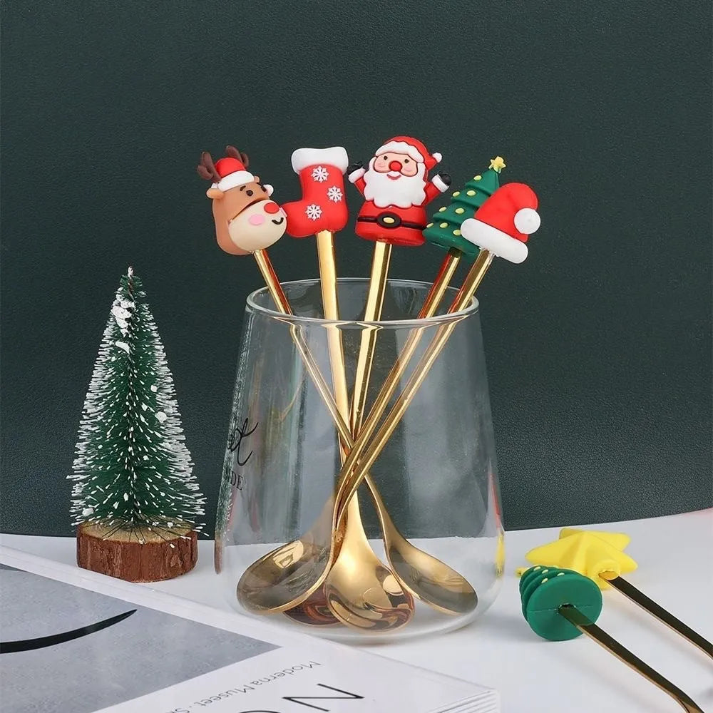 Red stainless steel Christmas spoon and fork set with snowman and Christmas tree designs on the handles.