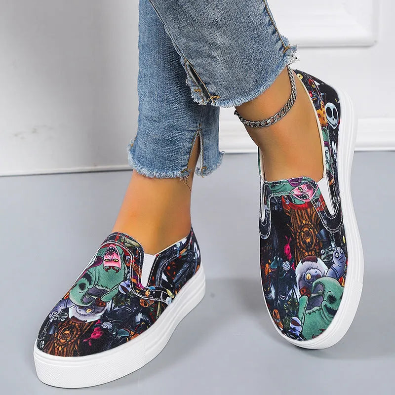 Women's low-top canvas slip-on shoes in colour matching pattern with rubber sole.
