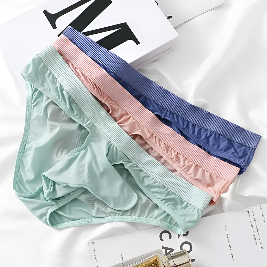 Men's low waist briefs underwear in Ice Silk fabric showing colour options: black, grey, purple blue, light green, pink.