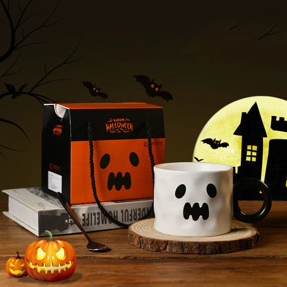 Festive Halloween pumpkin-shaped ceramic mugs in orange and white colors