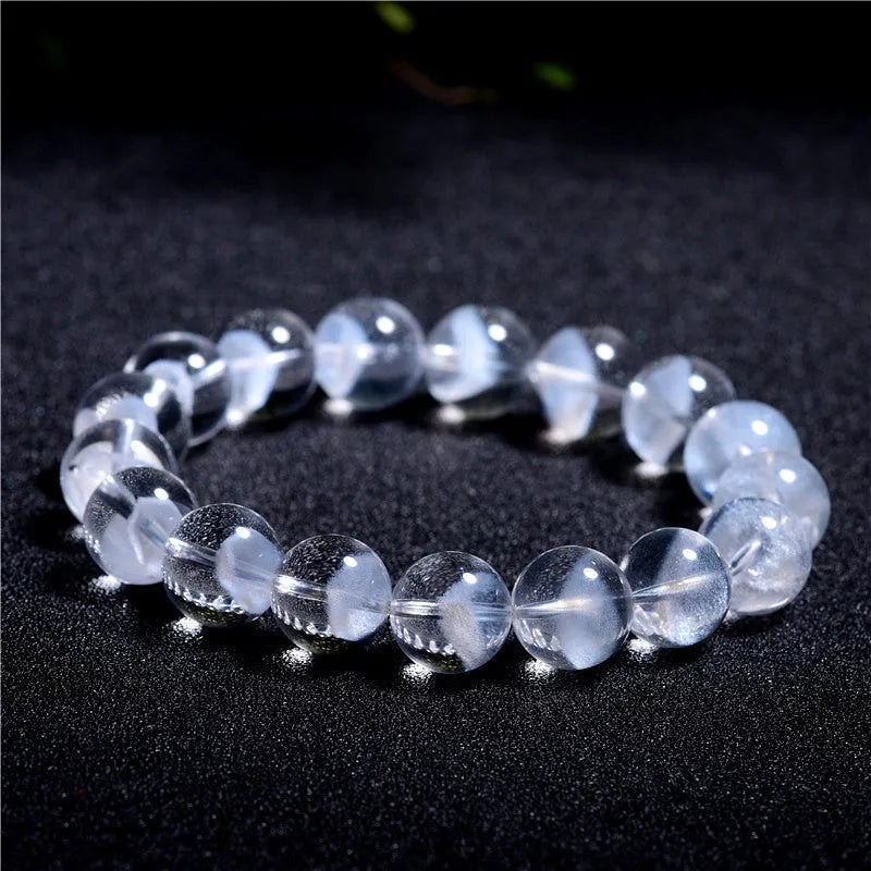 Women's natural white ghost bracelet with a white crystal pyramid charm and ruyi design elements.