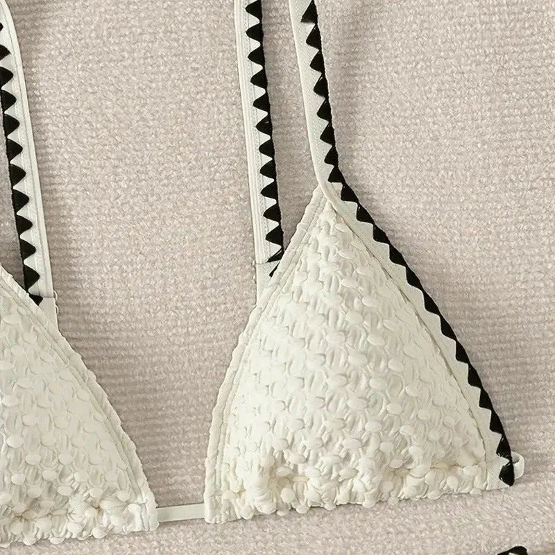 Women's two-piece split bikini swimsuit in white and blue colours with brief-style cut