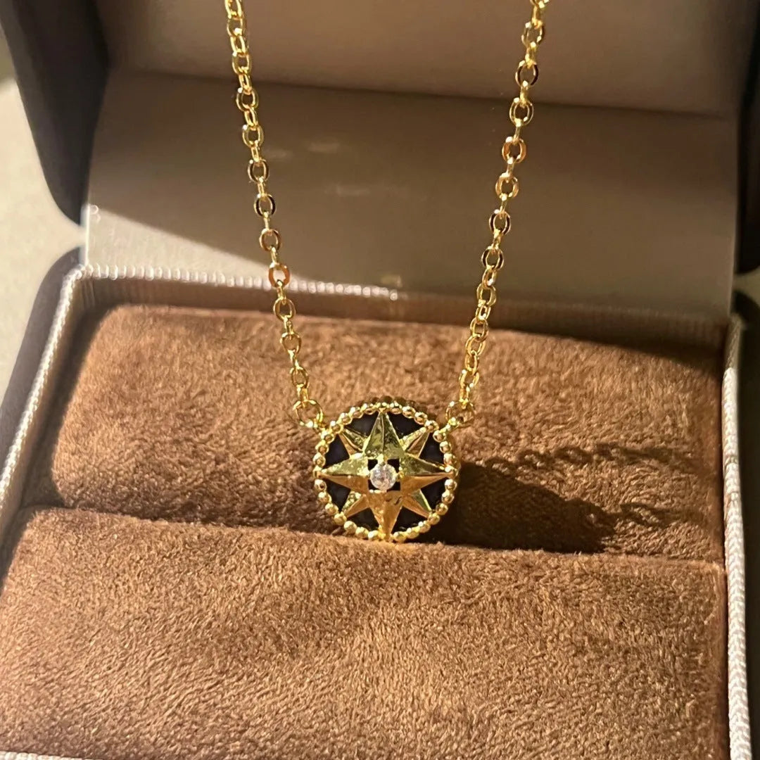 Women's compass necklace with round black agate inlay, geometric pendant, and curb chain in gold or platinum colour