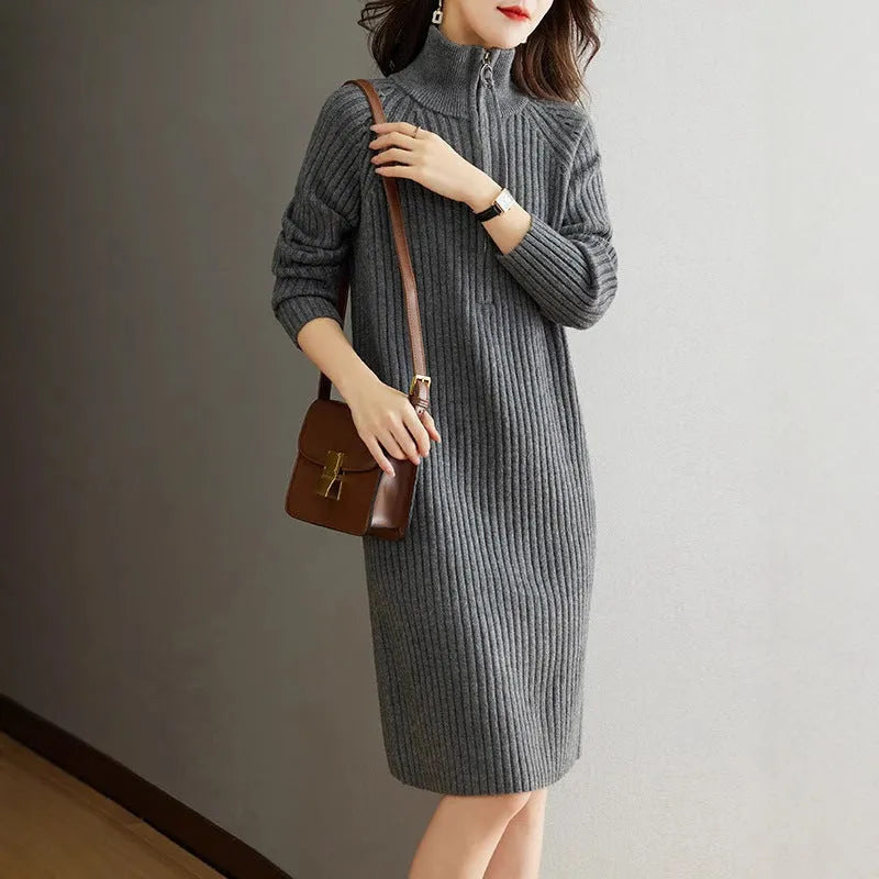 Beige casual skirt with half front zipper, stand collar, and long sleeves on a mannequin.