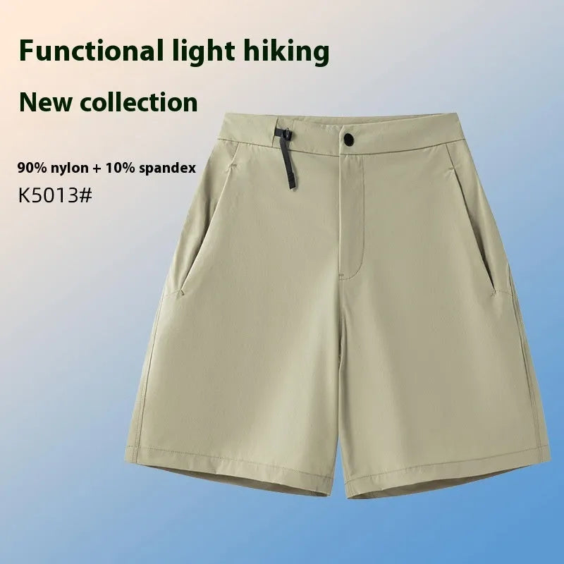 Man wearing solid-colour quick-dry sports shorts with an elastic waistband for running or climbing.