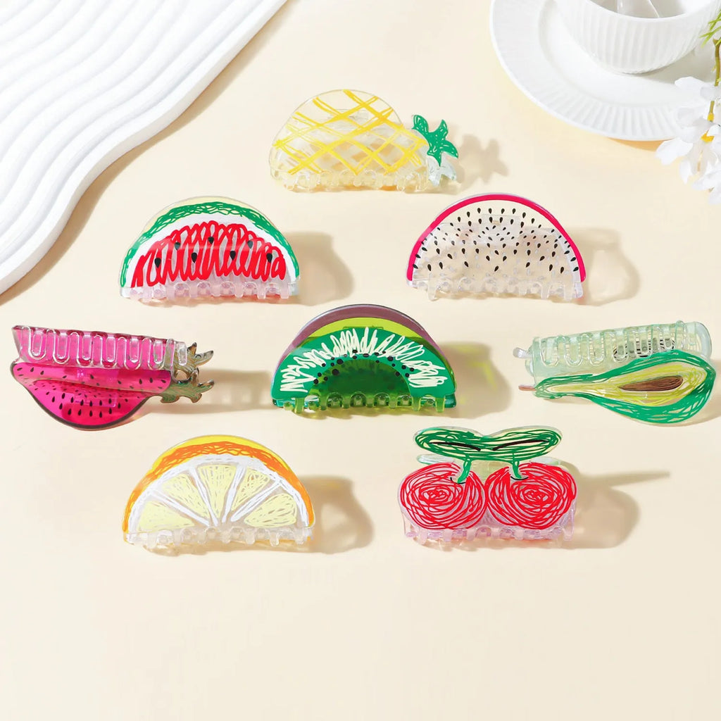 Korean creative fruit transparent PVC hair grip with asymmetric design on a white background
