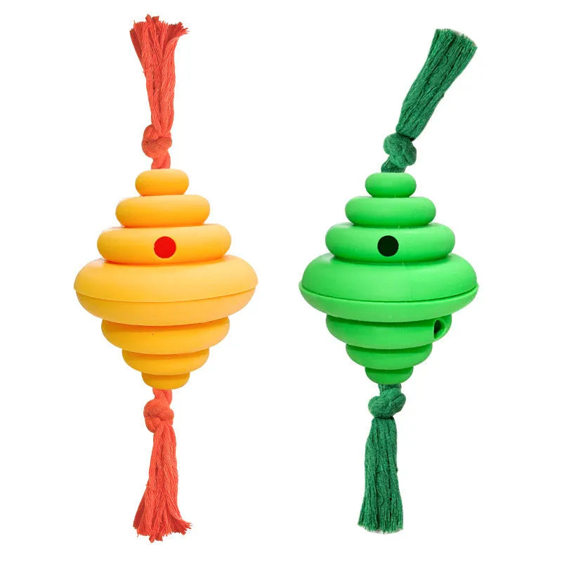 Green and yellow silicone dog ball with integrated rope, shown as a treat-dispensing and tug toy.