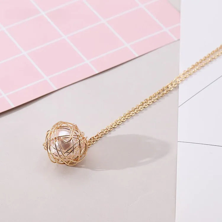 Gold minimalist pendant necklace with hollow ball and imitation pearl on twist chain 78cm
