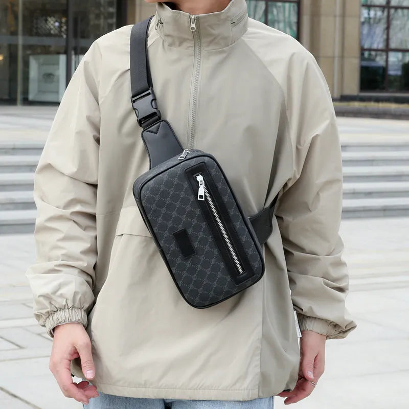 Men's black crossbody shoulder bag with printed chest design and sewing line detailing