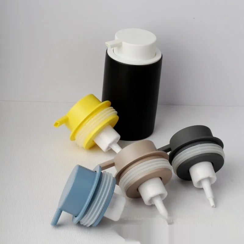 Large foam pump head for facial cleansers in metallic gold finish