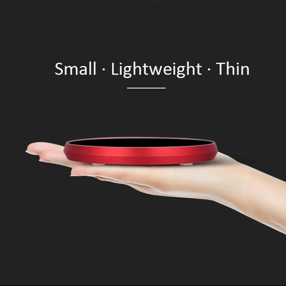 Black USB heating coaster with touch control for warming cups, showing three coloured indicator lights