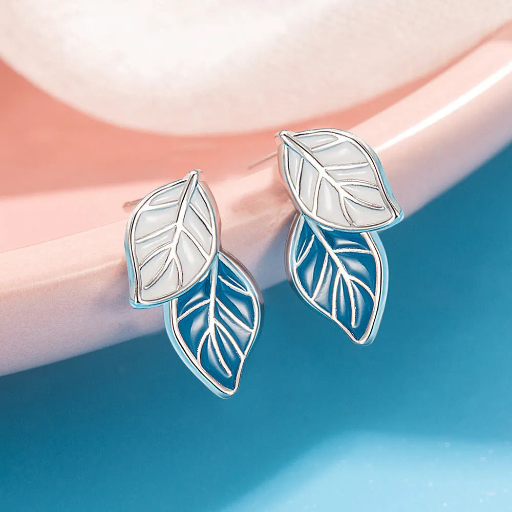 Leaf-shaped stud earrings for women in copper with white gold plating, geometric design, one pair