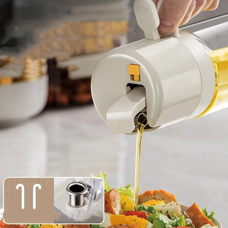Warm grey glass oil spray bottle with a black lid and switch for selecting spray or pour mode.