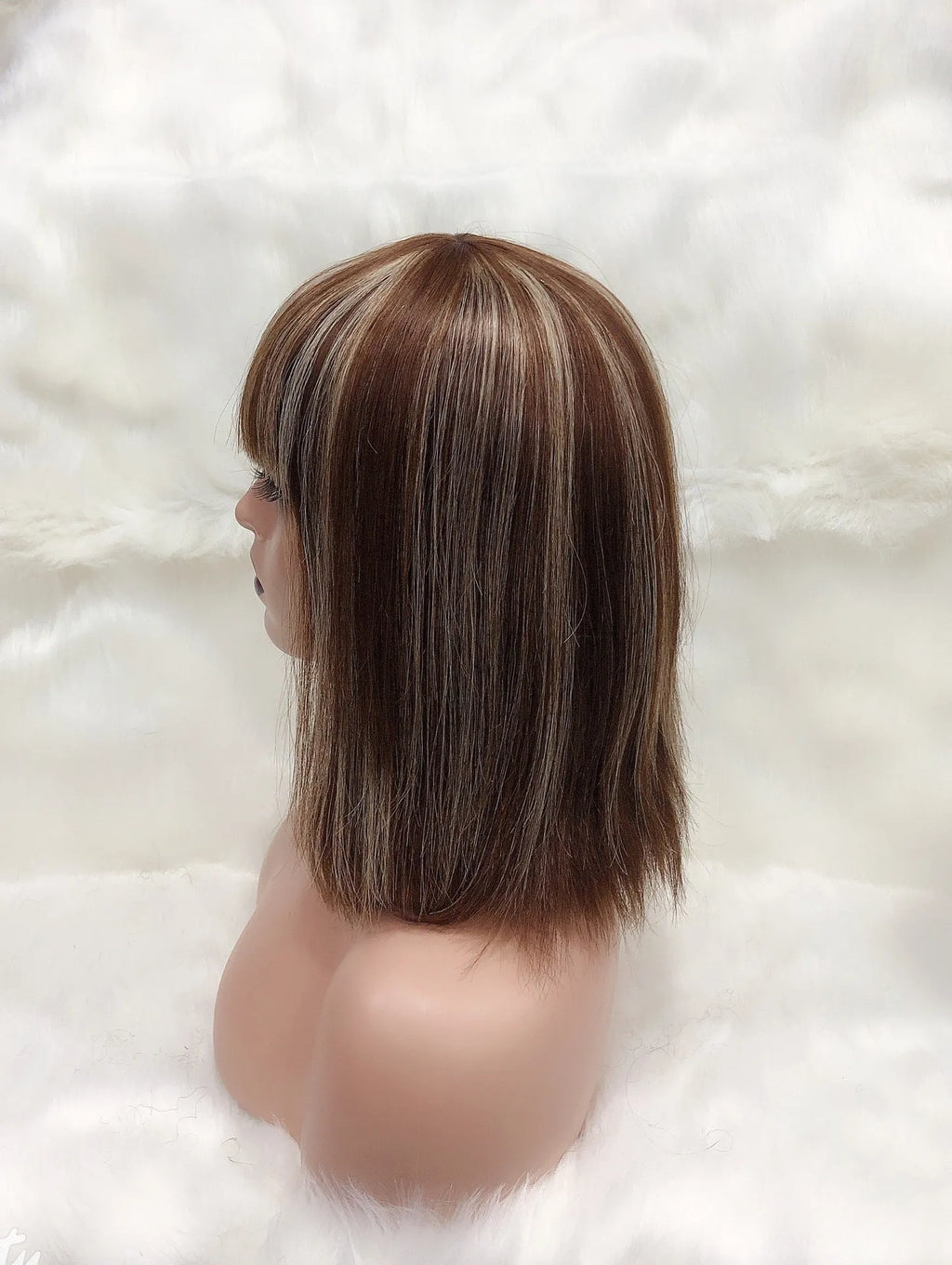 Full Mechanic 4 27 Bob human hair wig in brown with straight bangs, medium length on a mannequin head