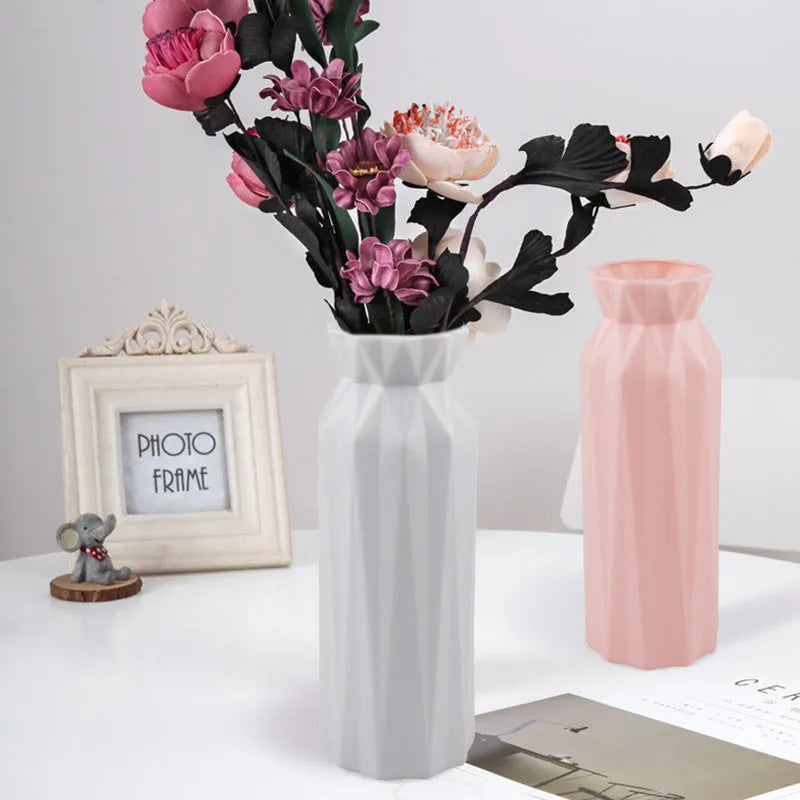 Simple green melamine plastic vase with a 7.2cm base diameter on a wooden table.