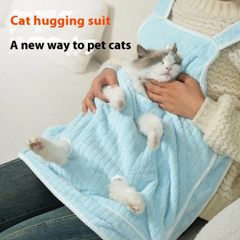Cloth cat grooming apron worn by person holding a cat, shown in light blue colour with hole option.