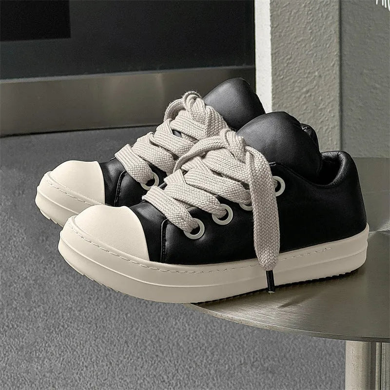 Men's black leather slip-on casual shoes with flat rubber sole and round toe on a white background.