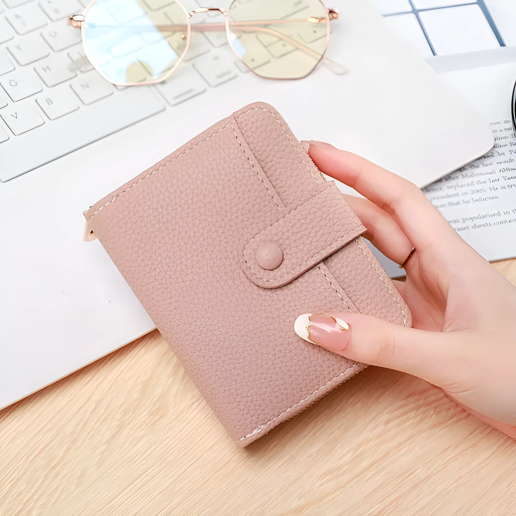 Ladies' short beige wallet with a lychee fruit pattern, shown folded.