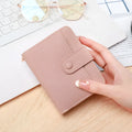 Ladies' short beige wallet with a lychee fruit pattern, shown folded.