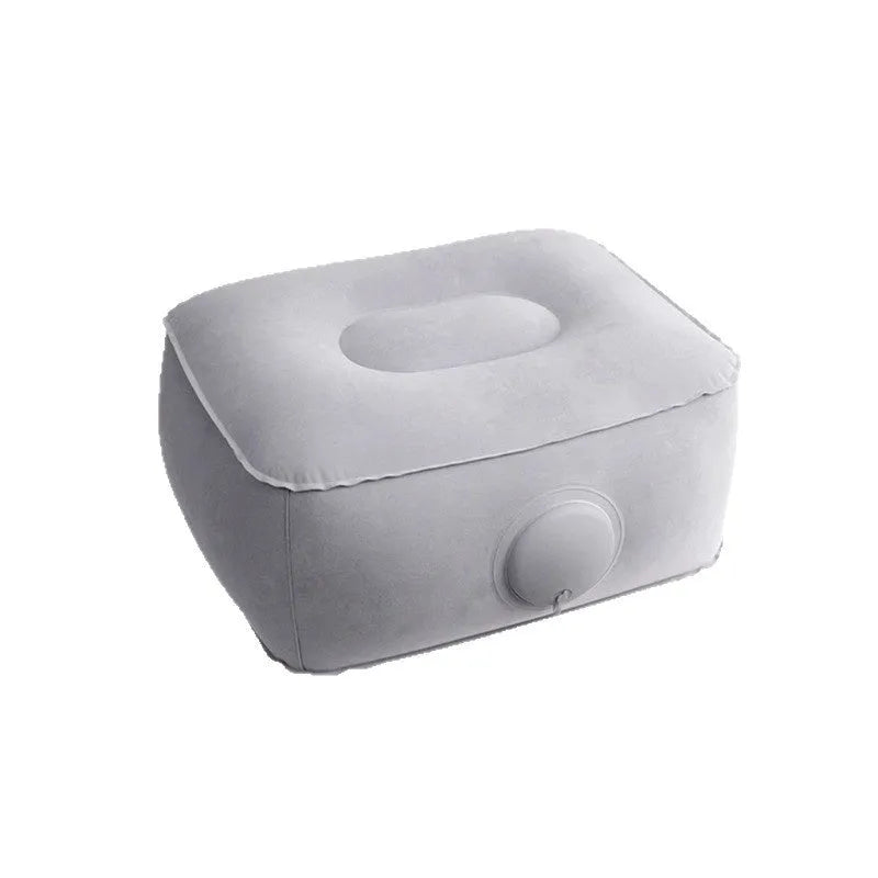 Press inflatable flocked seat cushion shown deflated and folded next to a chair.