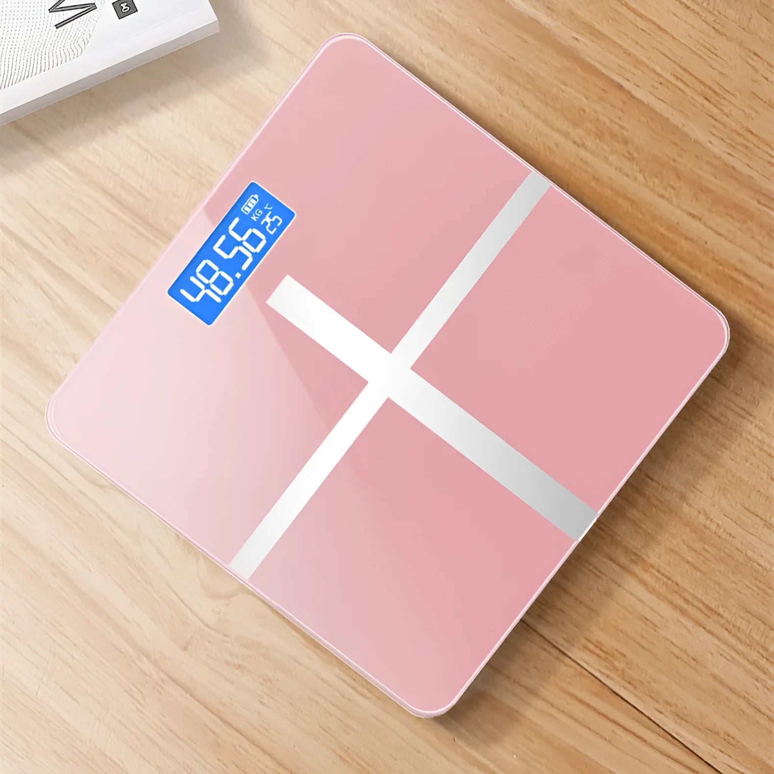 Electronic body weight scale with digital display in black, rose red or white finish.