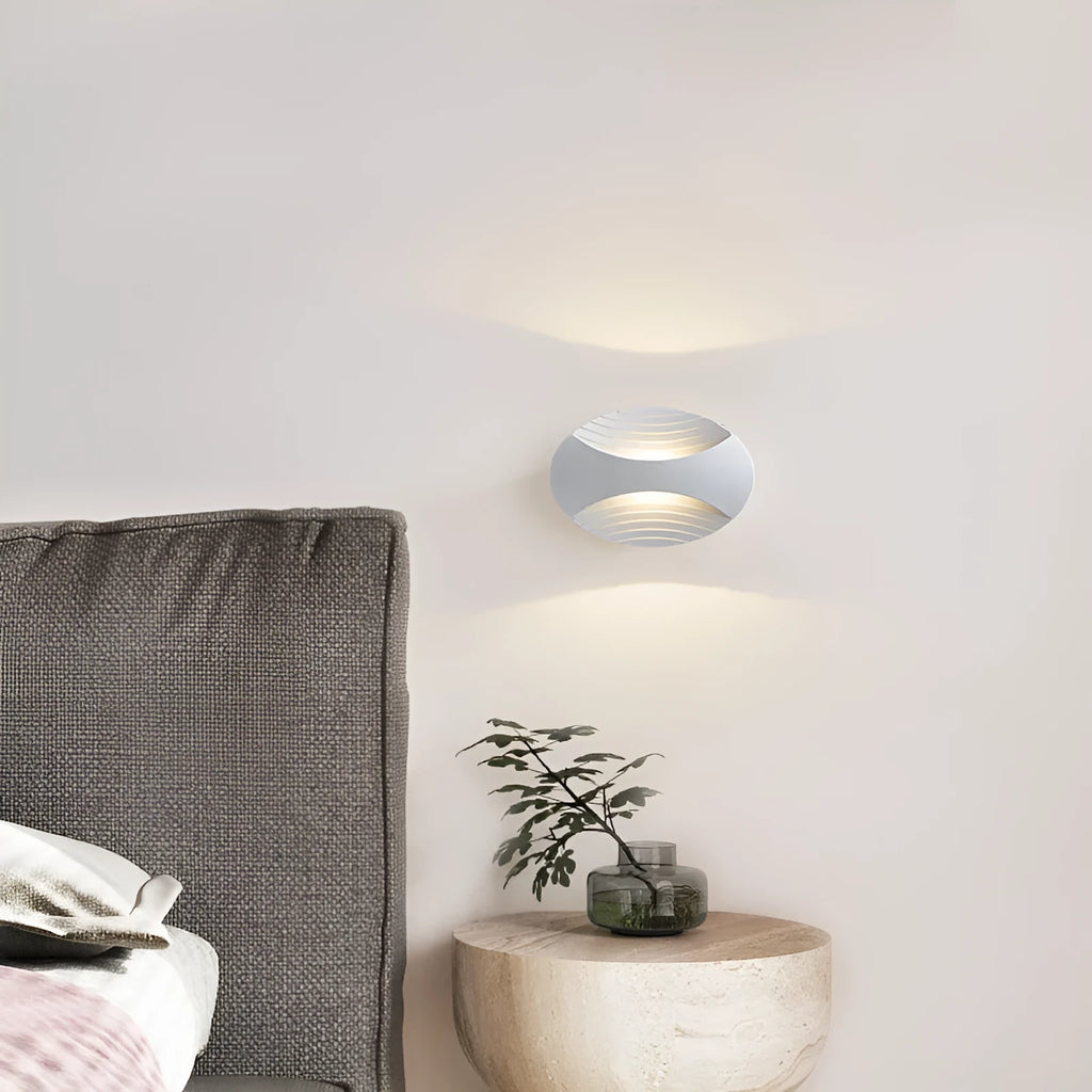 Modern minimalist aluminium bedside wall lamp showing three light colour options
