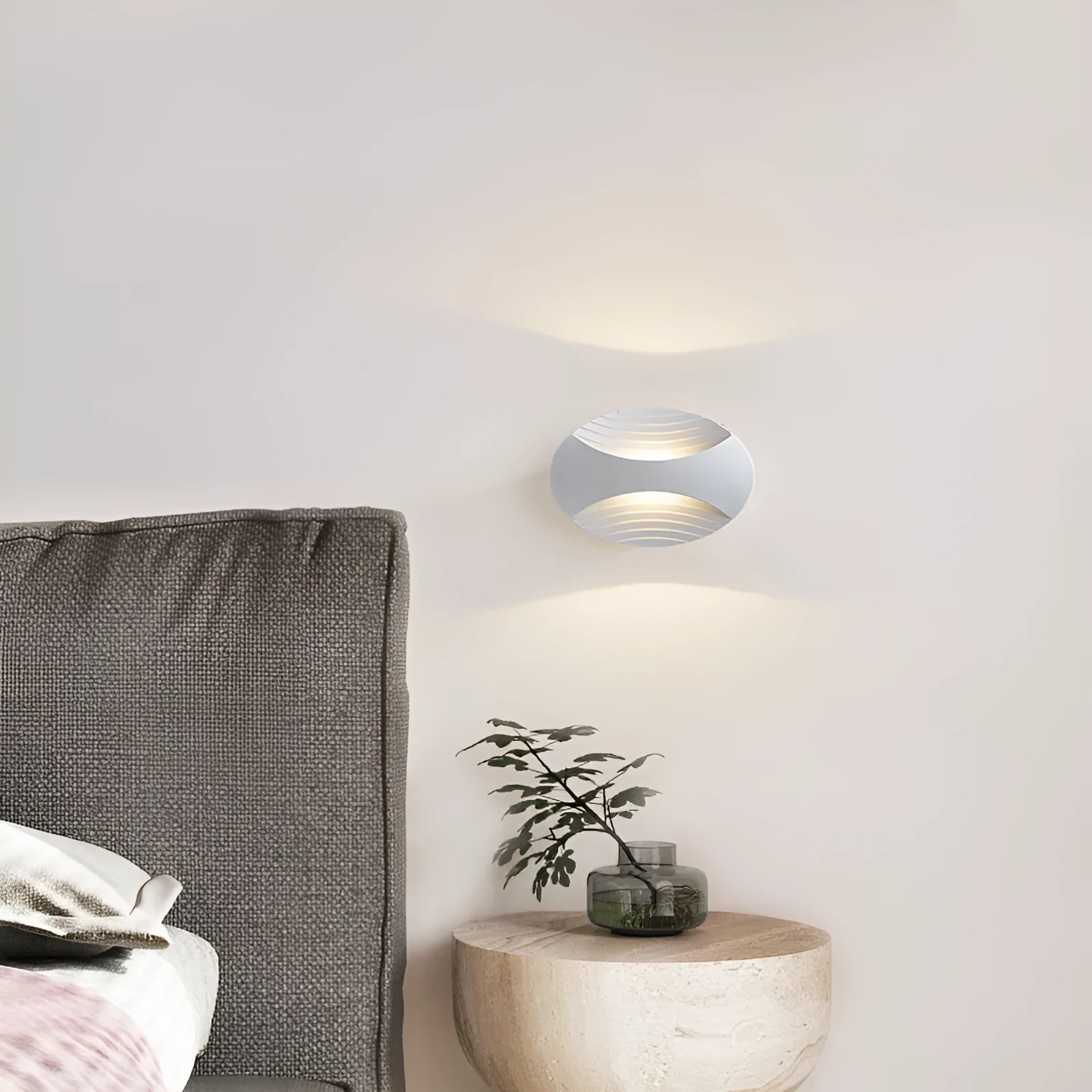 Modern minimalist aluminium bedside wall lamp showing three light colour options