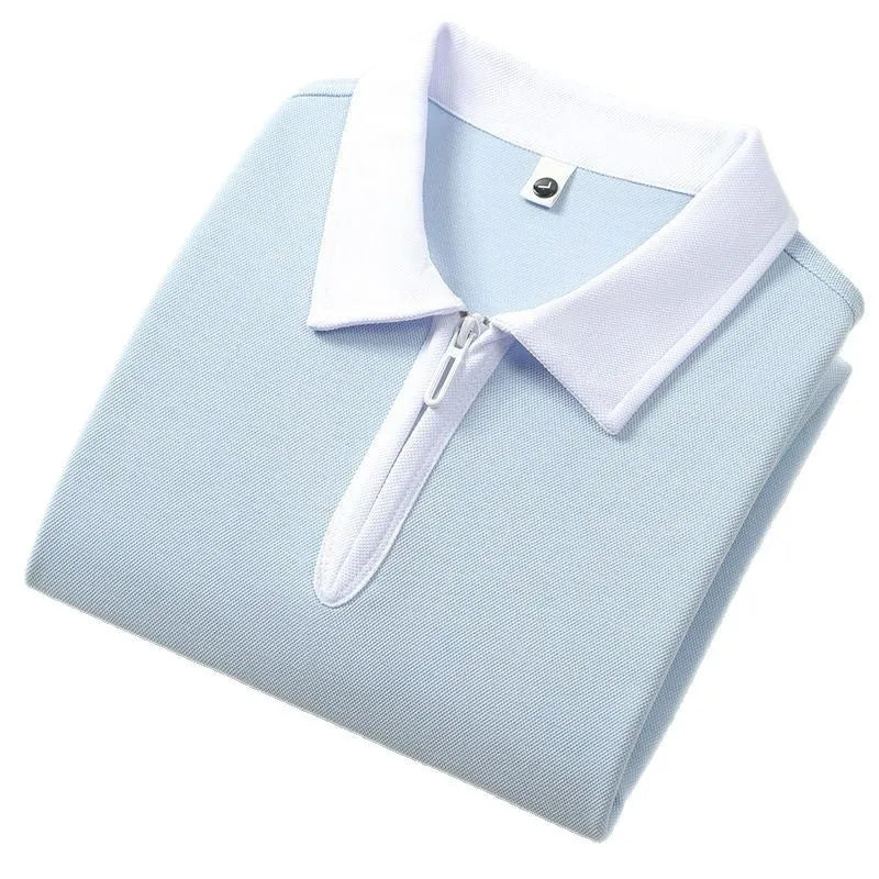 Man wearing a solid colour zipper and lapel polo shirt with short sleeves in a loose fit.