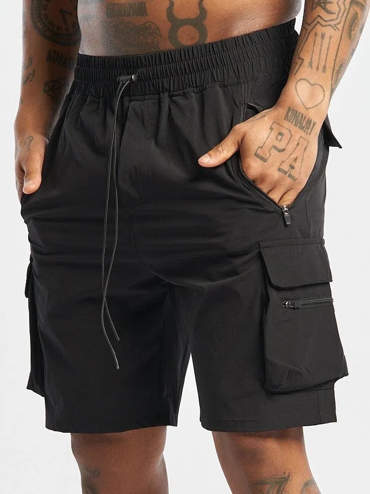 Men's black quick-dry sports shorts with elastic waistband for fitness and running.