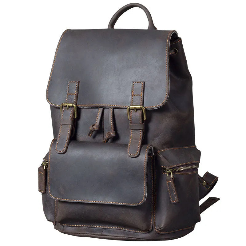 Brown genuine cowhide leather backpack with double shoulder straps and a soft handle.
