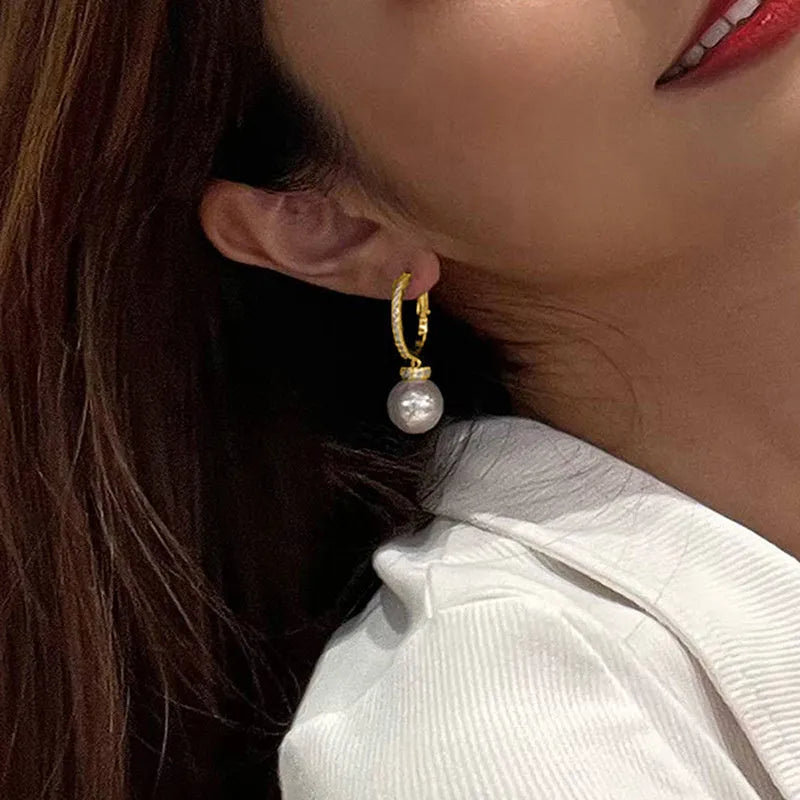 Yellow gold copper earrings with imitation pearl and inlaid zircon geometric ring design
