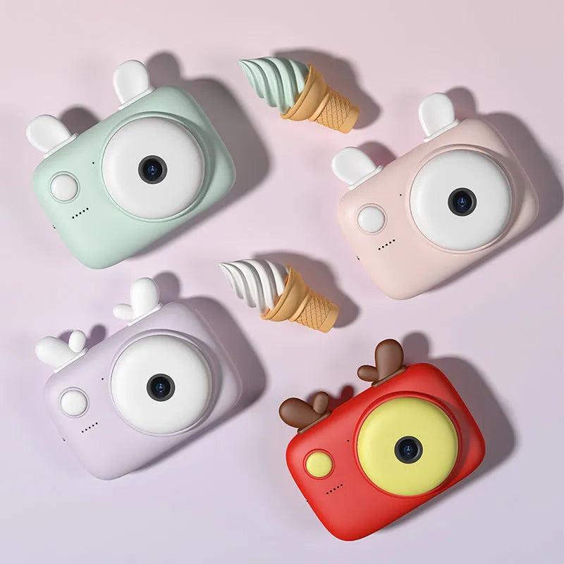 A2 Kids Macaron digital camera in colour options: green, pink, purple, or red.