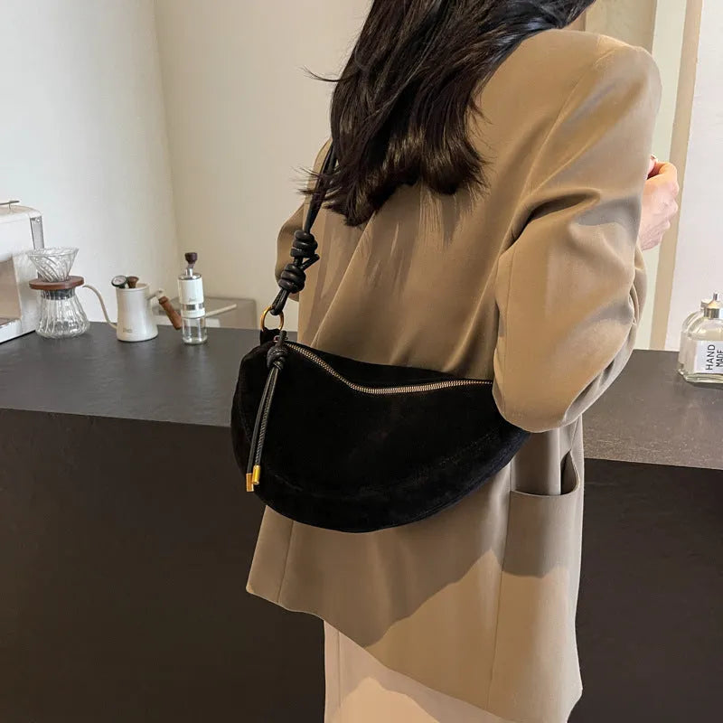 Soft PU leather crossbody underarm dumpling bag in black with sewing line detail and sandwich pocket
