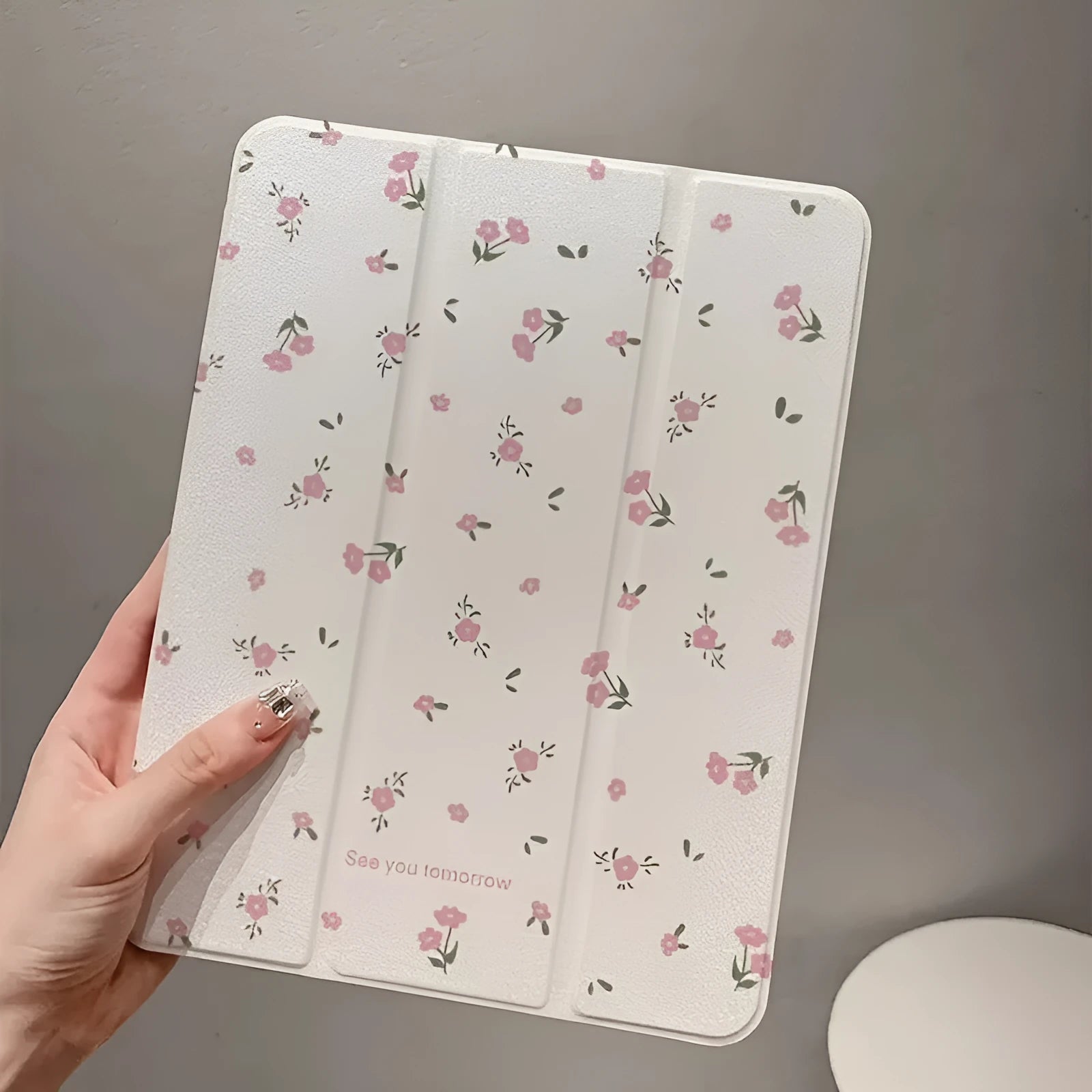 Transparent floral tri-fold tablet case for iPad showing magnetic stand position