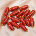 Ceramic bullet beads for jewellery making in various glaze colours including pink, yellow, blue, and red