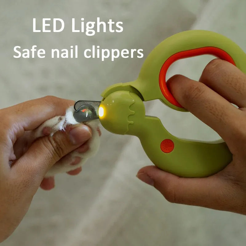 Blue pet nail clippers with LED light on, showing stainless steel cutting blades and non-slip handles.
