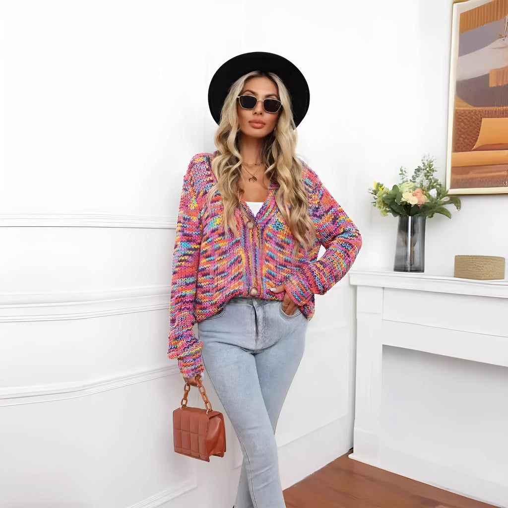Rose red women's short cardigan with rainbow festival stripes, loose fit, worn open as a coat.