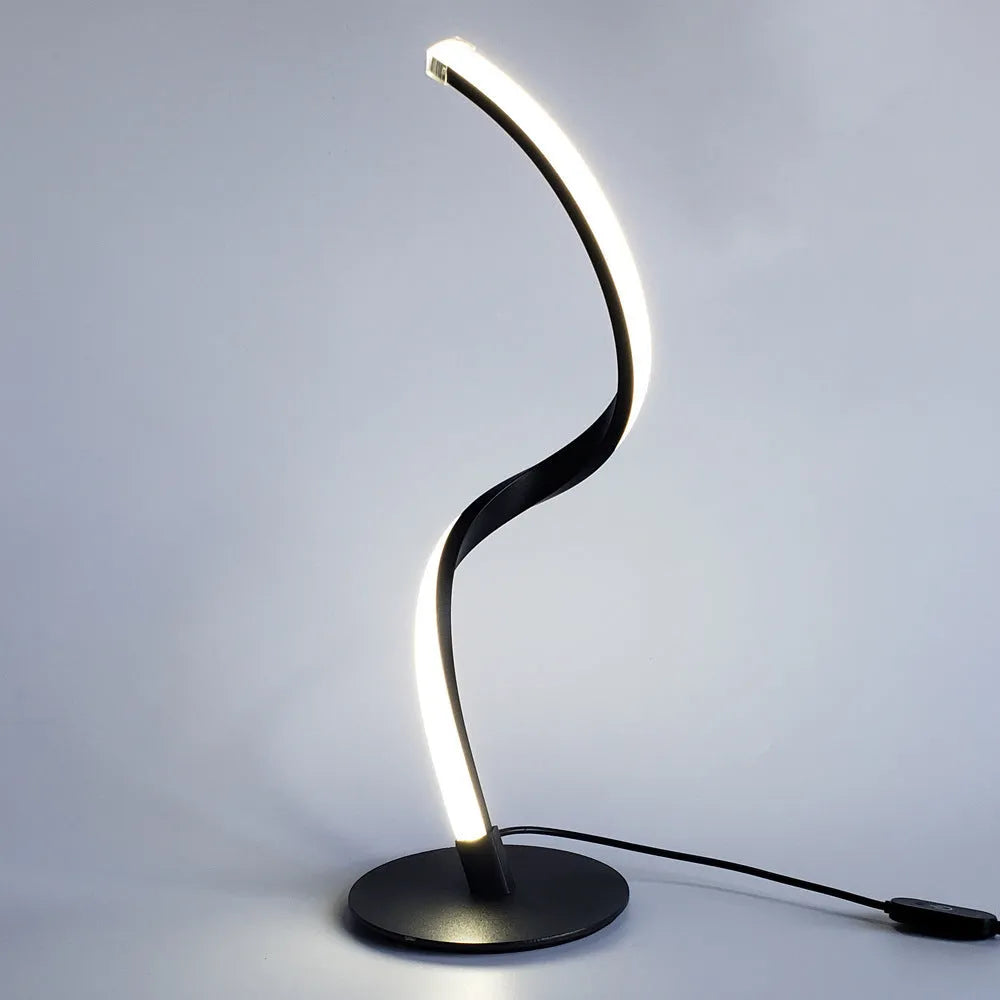 Advanced touch dimming desk lamp in white with white light mode on a bedside table