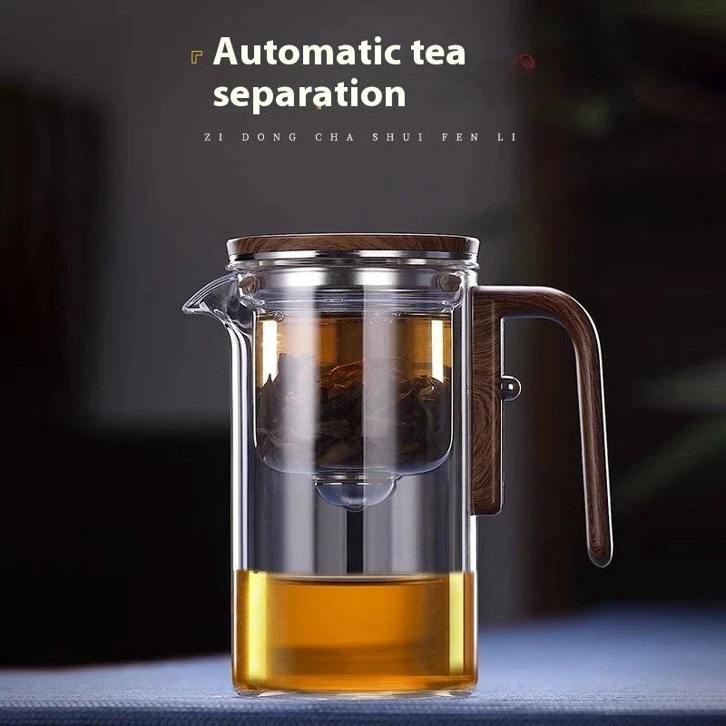 Innovative glass teapot with magnetic separation technology, wooden handle, and clear design for brewing and serving tea