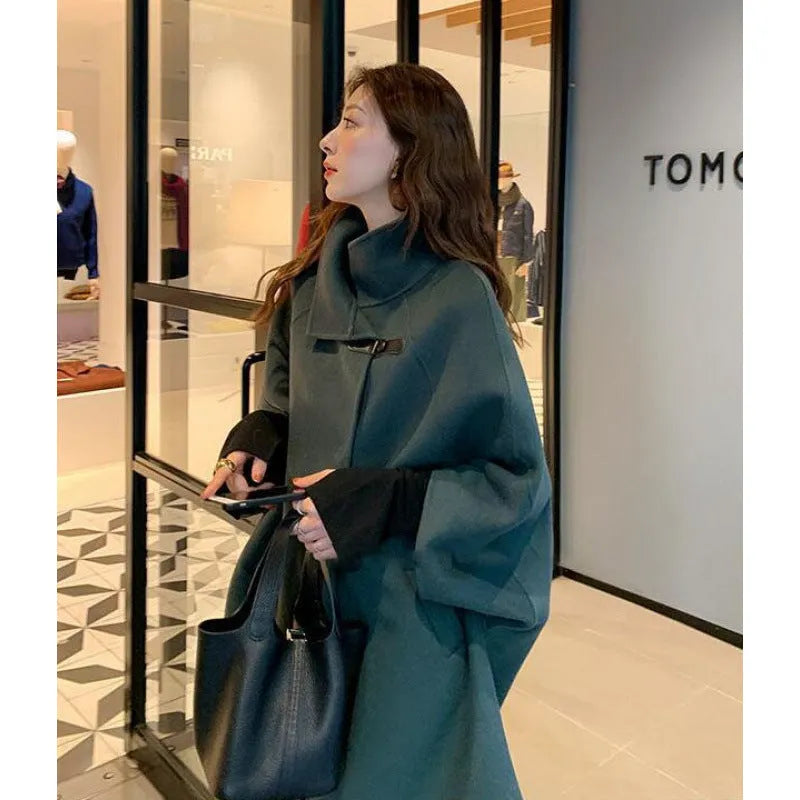 Women's Korean style long coat in oatmeal colour with flight sleeves and acrylic fabric