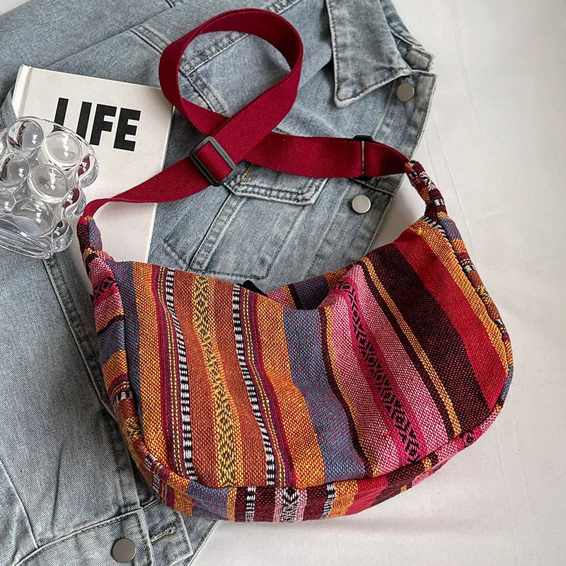 Women's ethnic style canvas dumpling crossbody bag in five colours.