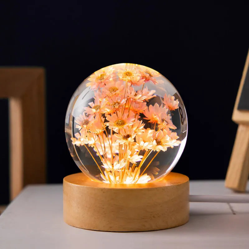 3D dandelion eternal flower night light in resin crystal ball on beech wood stand.