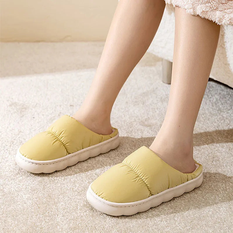 Blue thick-soled indoor slippers with artificial leather upper and plush lining on a rubber sole.