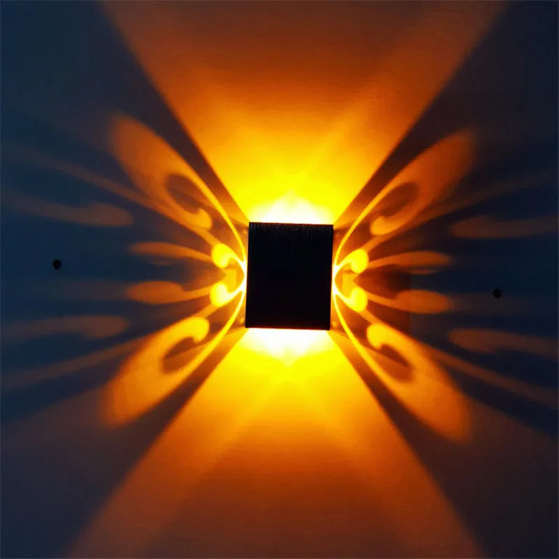Modern aluminium LED butterfly wall lamp showing blue light colour option