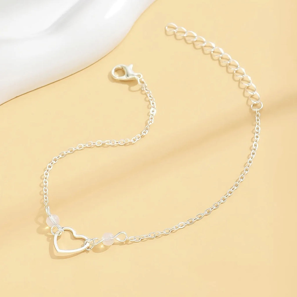 Adjustable gold alloy anklet with heart-shaped pendant on geometric chain
