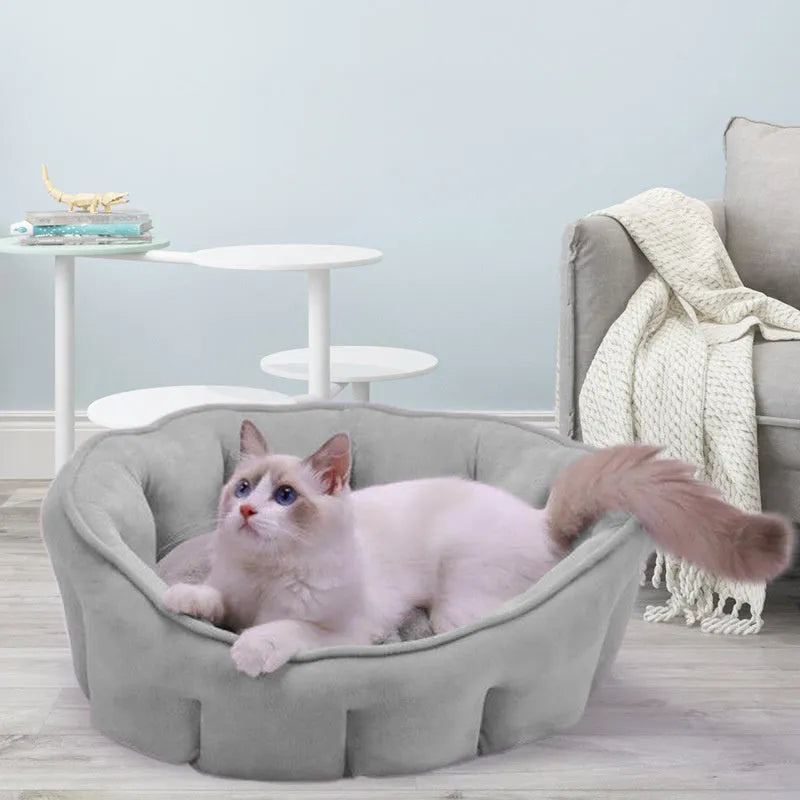 Grey plush cat kennel mat showing enclosed design with raised sides and soft interior.
